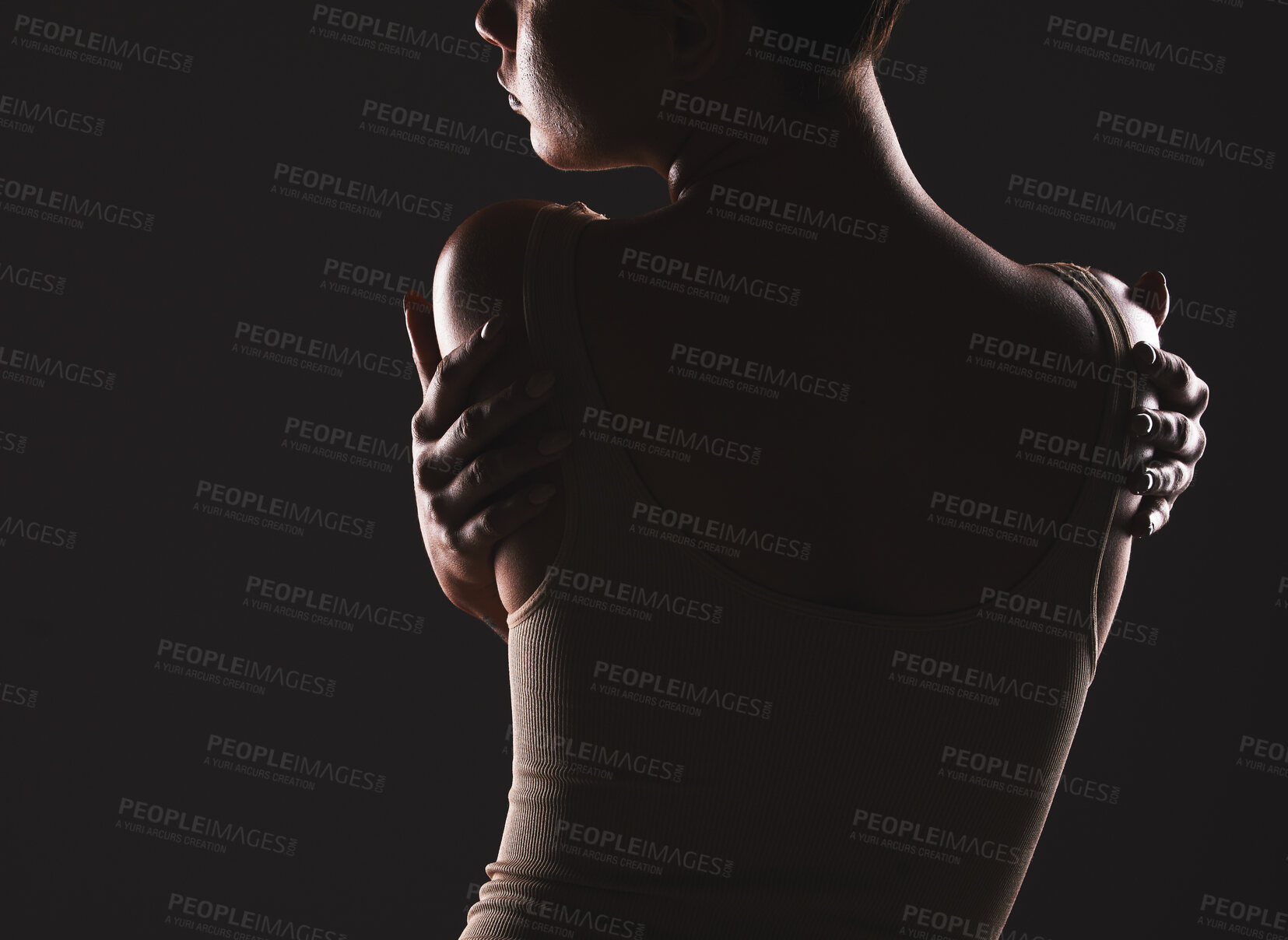 Buy stock photo Beauty, back and dark with a model woman posing in studio on a black background for artistic body positivity. Wellness, health and art with a young female standing to promote self love or self care