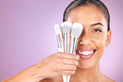 Buy stock photo Beauty, cosmetics and woman with brushes for makeup on purple background for skincare, fashion and style. Cosmetology, aesthetic and girl with brush set for foundation, beauty products and facial