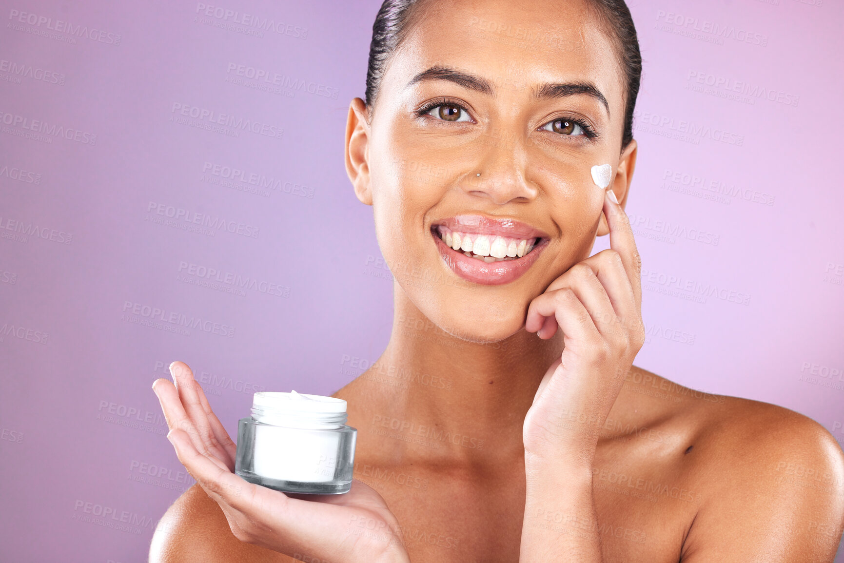 Buy stock photo Woman, skincare cream and portrait with smile, cosmetic beauty and healthy facial by lavender background. Model, face and cosmetics for natural glow, happiness and product by purple studio background