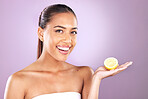 Skincare, lemon and woman in studio mockup for beauty, cosmetics and wellness with vegan, health or vitamin c promotion on purple background. Skin care model and fruit for natural dermatology results
