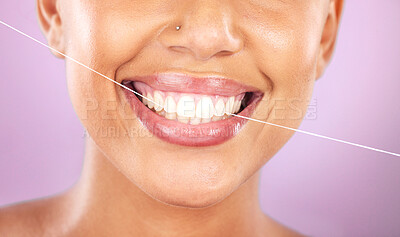 Buy stock photo Teeth, dental floss and beauty with woman, face zoom and smile, cosmetic and oral healthcare against purple background. Flossing, fresh breath and health for mouth, teeth whitening with Invisalign.