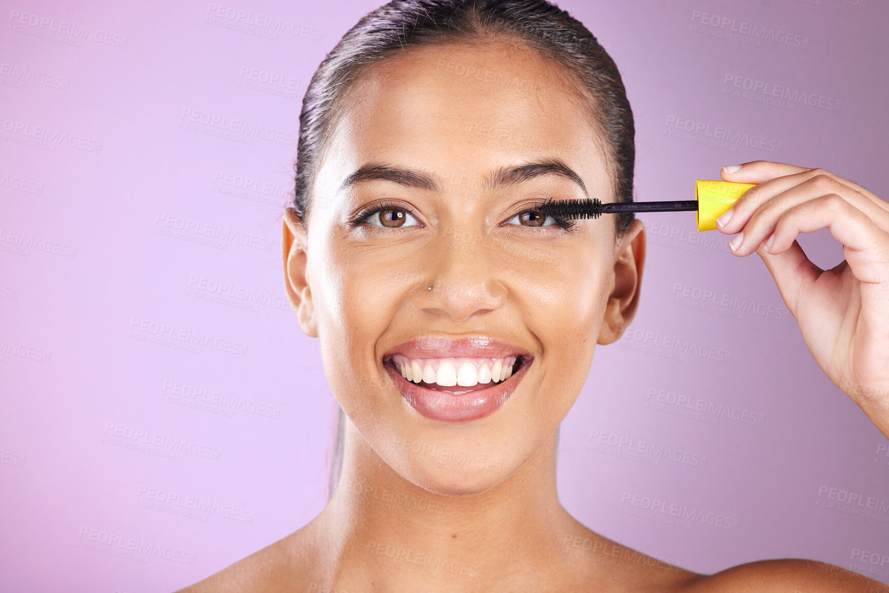 Buy stock photo Woman, face portrait and mascara brush for beauty wellness, cosmetics dermatology and natural skincare glow in purple background studio. Model, facial care and smile for happiness with makeup tool