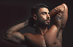 Man, body or muscle on black background in studio for fitness goals, workout or training motivation and healthcare wellness check. Bodybuilder, sports athlete or model flexing on aesthetic backdrop