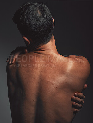Buy stock photo Hug, self love and back of a man with creative aesthetic, self expression and body on a dark black studio background. Skin embrace, art and mysterious model with love, self care and affection