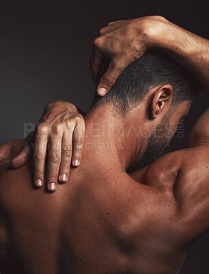 Buy stock photo Stretching, fit man and back muscle on dark black studio background. Self love, self care and model embracing skin, confidence and body positivity with an artistic body hug and creative expression