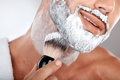 Buy stock photo Closeup, man and brush for shaving cream in studio for self care, grooming and facial hygiene with smile. Model, beard and foam for shaving, self love and cleaning for beauty, zoom and skincare
