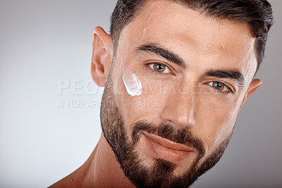 Buy stock photo Man, face and cream for skincare and beauty zoom with sunscreen, facial portrait and moisturizer. Lotion, skin wellness and glow with treatment, cosmetic care mockup against studio background