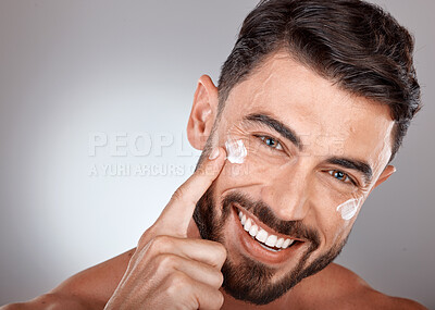 Buy stock photo Man, face and cream for skincare and beauty closeup with sunscreen, facial portrait and moisturizer. Lotion, skin wellness and glow with happy model, cosmetic care mockup against studio background