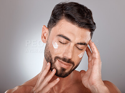 Buy stock photo Man, face and beauty with cream for skincare, moisturizer and skin lotion with cosmetics mockup against studio background. Grooming with hands for cosmetic care, facial treatment with wellness.