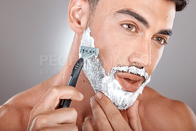 Buy stock photo Grooming, foam and shaving with face of man with razor for beauty, hygiene and skincare with morning routine. Self care, facial and shave beard with model and cream product for wellness and cleaning