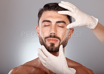 Buy stock photo Plastic surgery, cosmetics and man with doctor hands in studio mockup for botox, aesthetic or facial dermatology for medical or beauty. Mesotherapy, hyaluronic acid or collagen of young model face