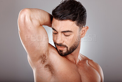 Buy stock photo Wellness, skincare and beauty of man for armpit hygiene, grooming and natural cosmetic campaign. Body care, aesthetic and confidence of model with healthy skin glow in gray studio background.

