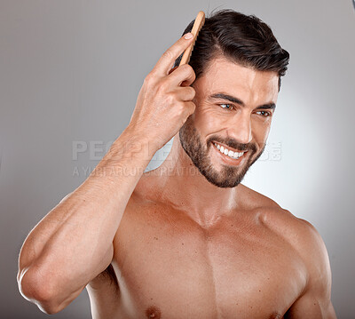 Buy stock photo Comb, beauty or man brushing hair in grooming advertising or marketing salon hair care products. Happy, studio background or healthy male model smiles with cool hairstyle in morning routine treatment