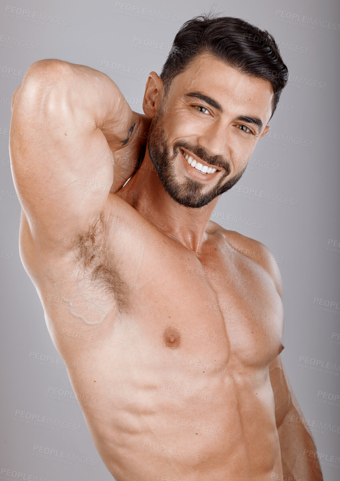 Buy stock photo Portrait, beauty and body with a man bodybuilder in studio on a gray background for health or fitness. Face, training and exercise with a handsome model male posing to promote a healthy lifestyle
