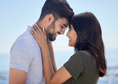 Buy stock photo Love, couple and hug at beach with travel and care on summer holiday by the ocean, commitment and support outdoor. Young, happy and relationship with romantic date, man and woman profile on vacation