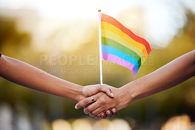 Buy stock photo LGBTQ rainbow, flag and couple holding hands for gay pride, lesbian support or human rights activist. Transgender, love and African black people together for equality, partnership and LGBT community