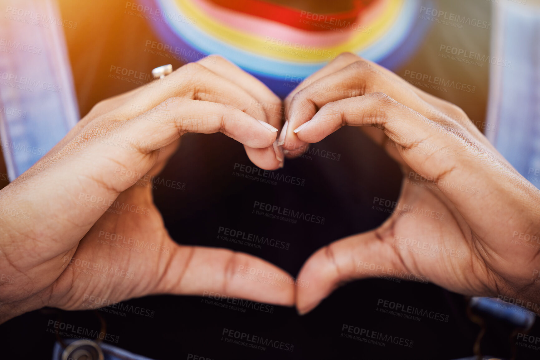 Buy stock photo LGBTQ, pride and hands with a heart sign for love, equality and solidarity of a gay woman. Rainbow, freedom and closeup of lesbian female with a hand symbol at a gay pride celebration festival.