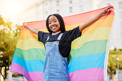 Buy stock photo Black gay woman, rainbow flag and lgbtq pride with a smile for sexuality freedom, non binary and gender neutral lifestyle. Portrait of young lesbian girl in city of France for equality and love