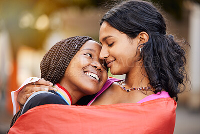 Buy stock photo Love, hug and happy lesbian couple at a freedom, equality or LGBTQ festival, event or parade. Happiness, smile and gen z interracial gay women embracing, hugging and bonding together in the city.