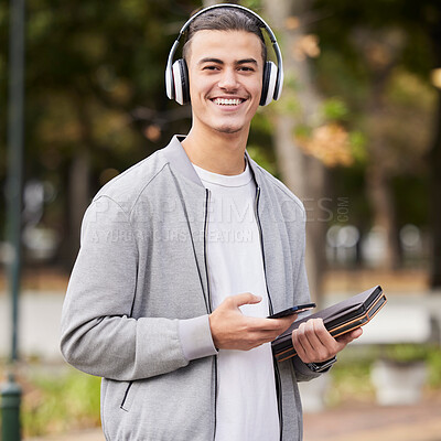 Buy stock photo Smartphone, headphones and student portrait in park for study at university, college or campus scholarship, knowledge and learning. Happy man with music technology with books for exam, test or school