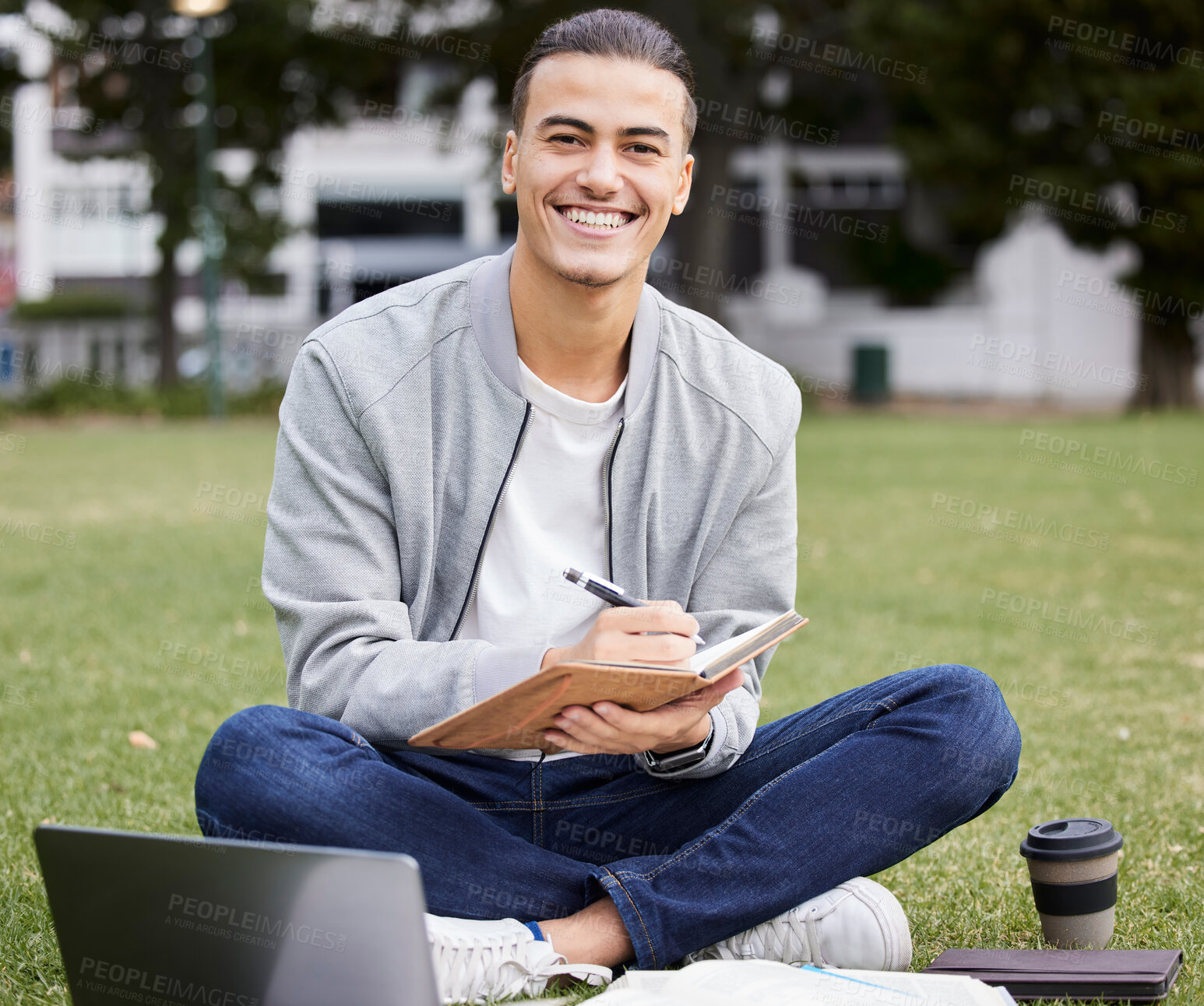 Buy stock photo Study, laptop and student portrait in park writing at university, college or campus for research, planning schedule and scholarship. Happy man relax and learning with technology and notebook for exam