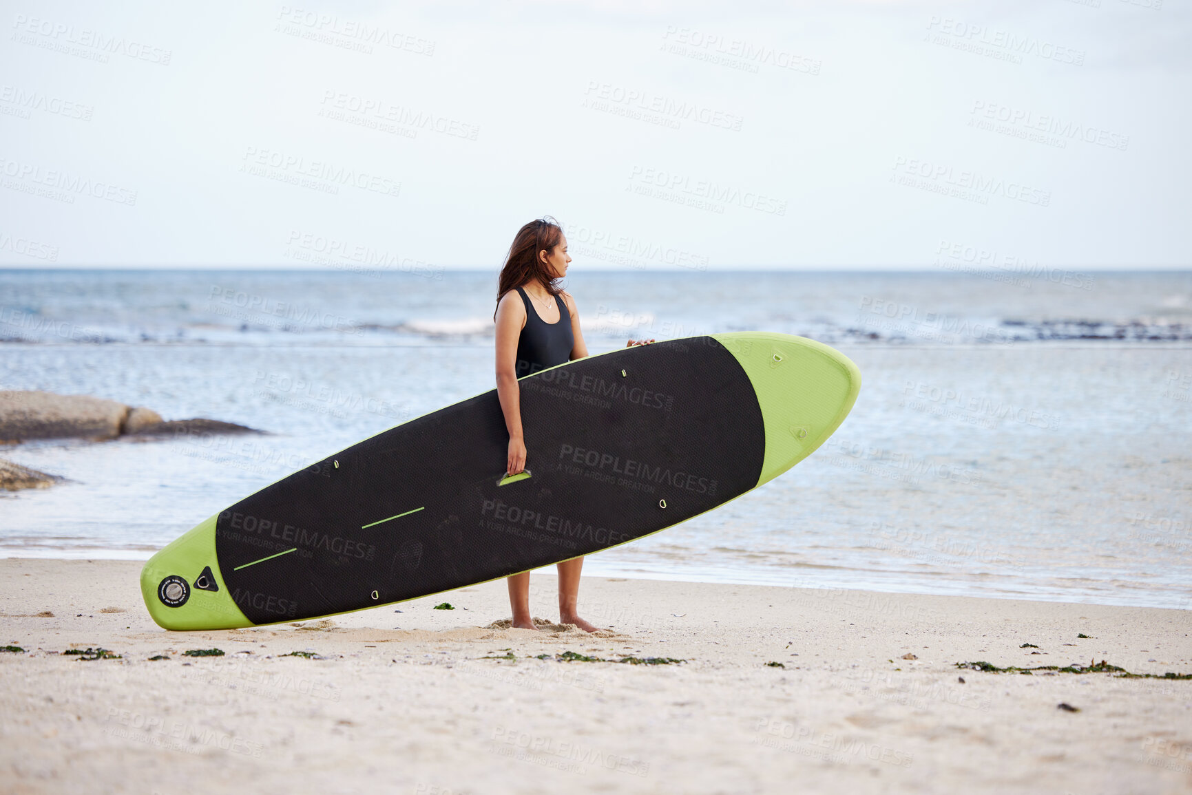 Buy stock photo Relax, woman or surfer at a beach on holiday with a surfboard for fitness training, cardio exercise or workout. Freedom, Thinking or sports girl looking at ocean waves for surfing opportunity at sea