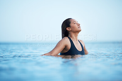 Buy stock photo Sea, swimming and relax with a woman in nature, outdoor on holiday or vacation enjoying a swim in the ocean with mockup. Water, summer and freedom with a female swimmer outside for travel or tourism