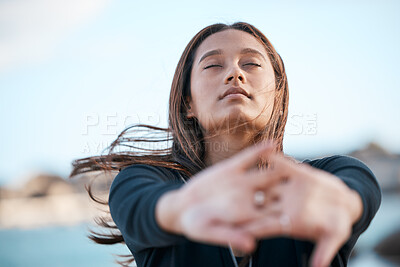 Buy stock photo Stretching, focus and woman at the beach for fitness, running and morning cardio in Portugal. Freedom, yoga and girl with an arms warm up for exercise, training start and body health at the sea