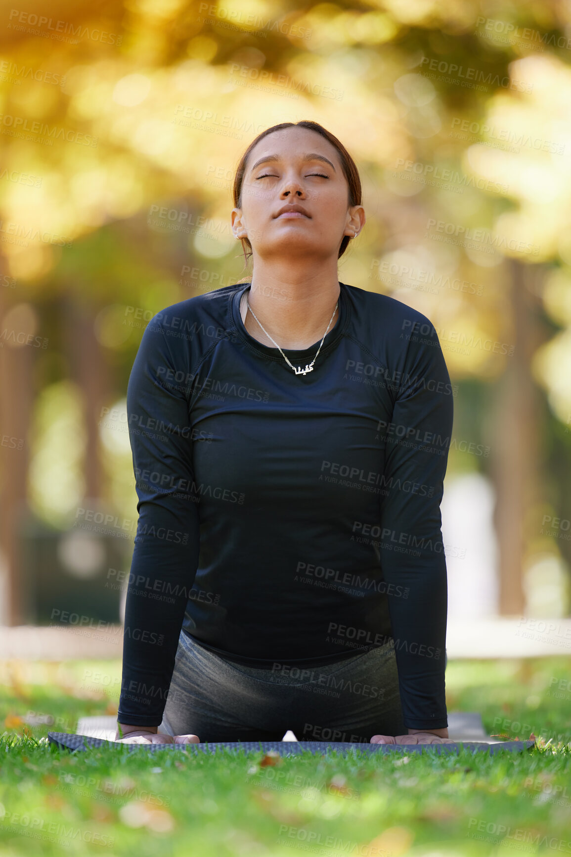 Buy stock photo Yoga, cobra stretching and woman at park for health, wellness and flexibility. Zen chakra, pilates pose and female with eyes closed training, meditation and exercise, workout and mindfulness outdoors