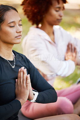 Buy stock photo Women friends, namaste hands and yoga meditation at park, wellness and freedom of chakra energy, zen fitness or peace. Calm girls, relax exercise and meditate with prayer in nature for mental health 