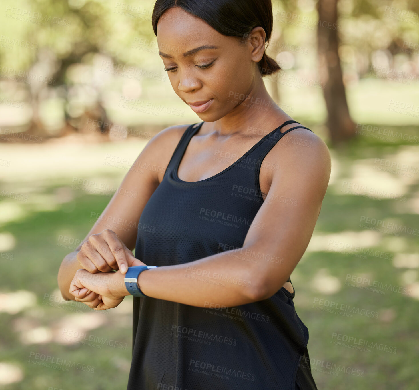 Buy stock photo Time, fitness or black woman in nature with a smartwatch to monitor heart health in training, exercise or park workout. Wellness, digital or girl runner checking running performance stats in Nigeria