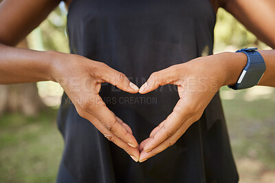 Buy stock photo Hands, heart sign and fitness with a yoga black woman outdoor for meditation, mental health or wellness. Nature, peace and park with a female athlete meditating outside for loving peace or balance
