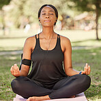 Yoga, black woman meditation in park with lotus pose, earphone for mindfulness podcast and zen outdoor in nature. Peace, spiritual energy and balance self care and music with fitness and wellness