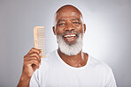 Senior black man with smile, comb and body hair, beauty and grooming with hygiene and cosmetic care against studio background. Hair care mockup, beard with portrait and face treatment and cosmetics