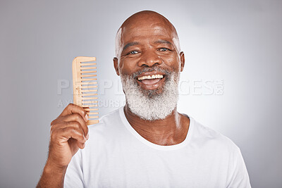 Buy stock photo Senior black man with smile, comb and body hair, beauty and grooming with hygiene and cosmetic care against studio background. Hair care mockup, beard with portrait and face treatment and cosmetics