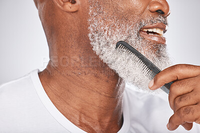 Buy stock photo Elderly, black man and comb for beard, beauty and grooming with hygiene and cleaning face zoom. Hair care, brush body hair and wellness with cosmetic care and natural against studio background