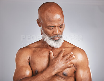 Buy stock photo Senior black man, hand holding chest pain on gray background and medical emergency in retirement age. Heart problem, effects of stress on old body or elderly african person with muscle injury