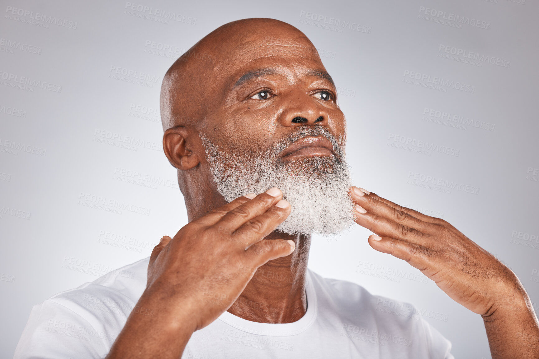 Buy stock photo Black man, face and senior self care for beard and facial. hair while grooming or shaving for clean skin. Headshot of African male on grey studio background for beauty, skincare and dermatology