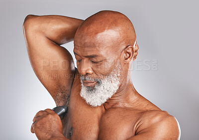 Buy stock photo Grooming, deodorant and armpit of a senior black man for shower care, hygiene and body health on a grey studio background. Clean, underarms and elderly African model with a product for fresh smell