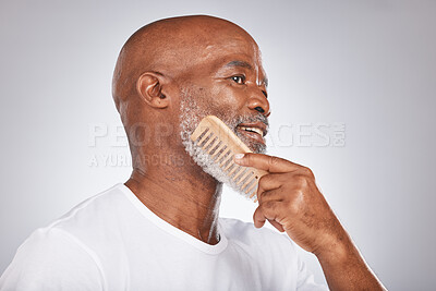 Buy stock photo Elderly, black man with comb for beard, beauty and grooming with hygiene and cosmetic care against studio background. Hair care mockup, brush body hair and face with hair treatment and cosmetics