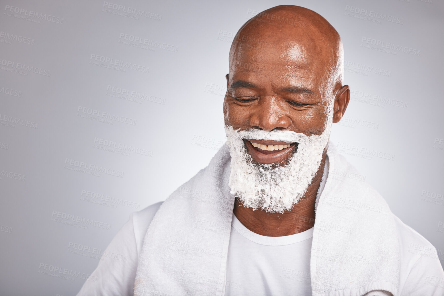 Buy stock photo Face, shaving cream and happy black man with beard and smile, skincare treatment on grey background. Health, mock up and facial hair, mature man morning shave foam with space for product placement. 