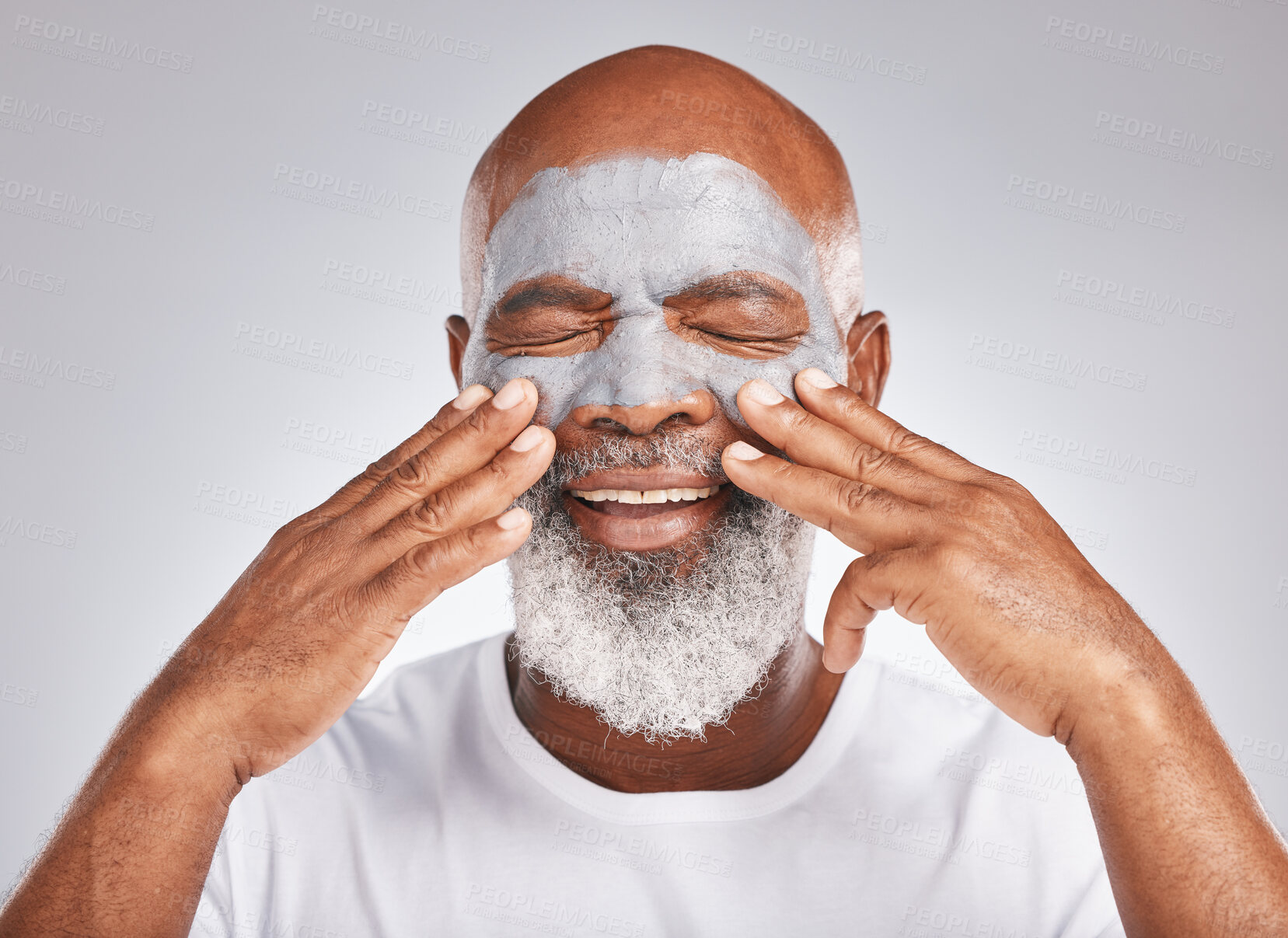 Buy stock photo Skincare, hands or old man with facial cream marketing or advertising luxury beauty product for self care. Studio background, cosmetics or elderly black man with a happy smile applying face mask