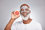 Grapefruit, face mask and portrait of man, healthy skincare and beauty, wellness and makeup of anti aging, detox or natural facial cleaning. Happy face, studio male model and vitamin c fruits of glow