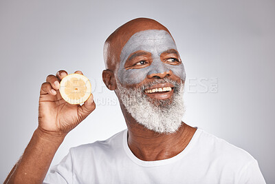 Buy stock photo Skincare, face mask or happy black man with lemon fruit marketing or advertising natural vegan diet for glowing skin. Cream, smile, African old man with beauty or healthy anti aging facial cosmetics