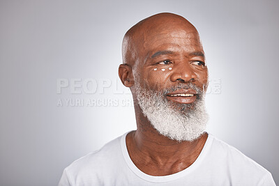 Buy stock photo Black man, beauty and facial cream for skincare of senior in studio for self care with dermatology and cosmetic product on skin. Face of happy male with lotion for glow, health and wellness on grey