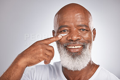 Buy stock photo Beauty, facial cream and skincare of black man in studio for self care with lotion, dermatology and cosmetics. Face portrait of happy senior male with a product on skin for glow, health and wellness