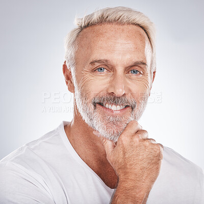 Buy stock photo Face portrait, thinking and senior man in studio isolated on a gray background. Skincare, cosmetics and retired, elderly and happy male model contemplating ideas for beauty, grooming and wellness.