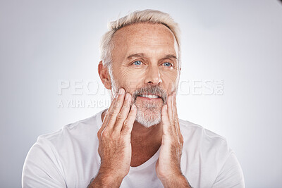 Buy stock photo Mature man touching skincare, facial beauty and barber grooming service on studio background. Male model feeling clean face, beard and moisturizer for beauty, natural body care and bathroom wellness
