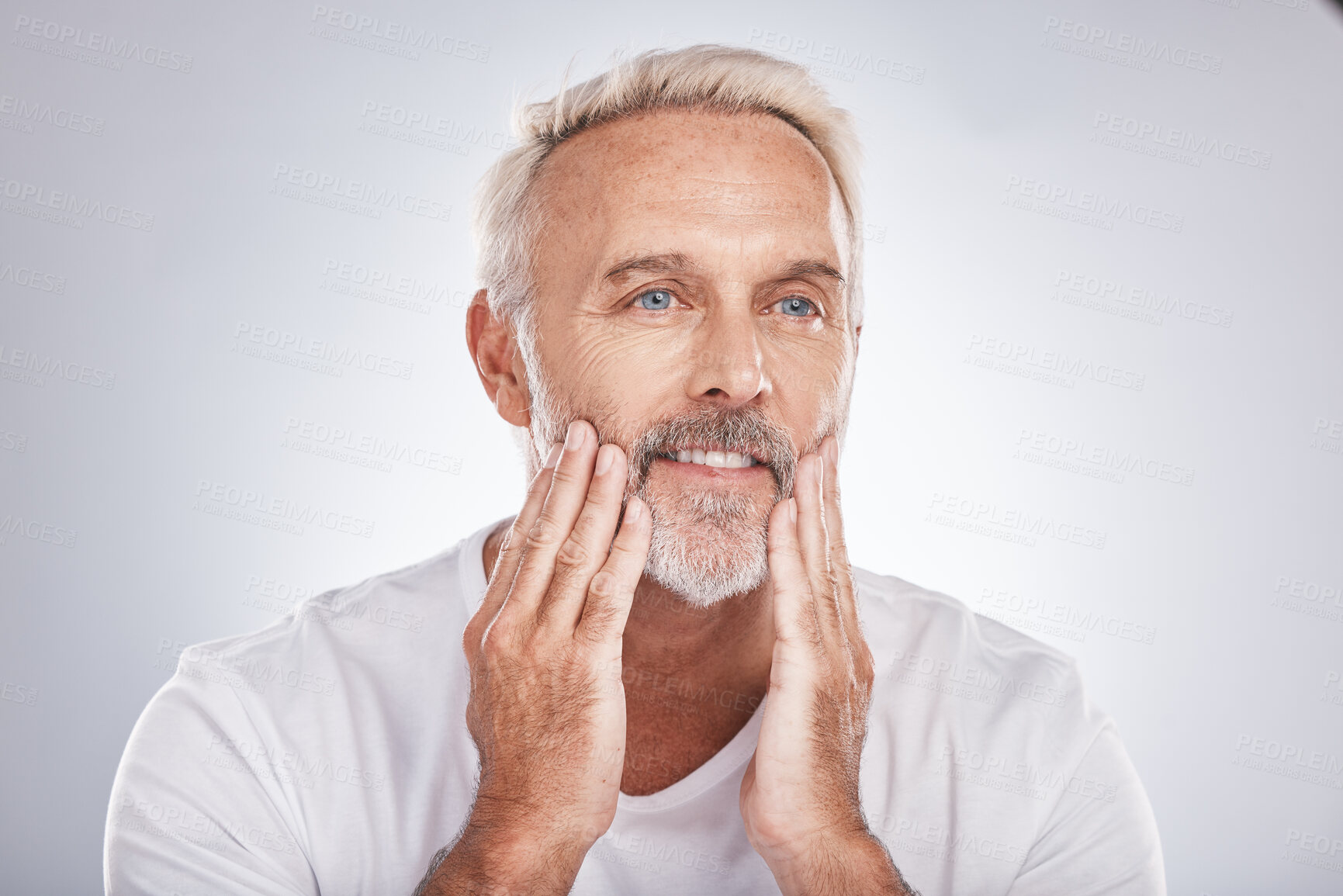 Buy stock photo Mature man touching skincare, facial beauty and barber grooming service on studio background. Male model feeling clean face, beard and moisturizer for beauty, natural body care and bathroom wellness