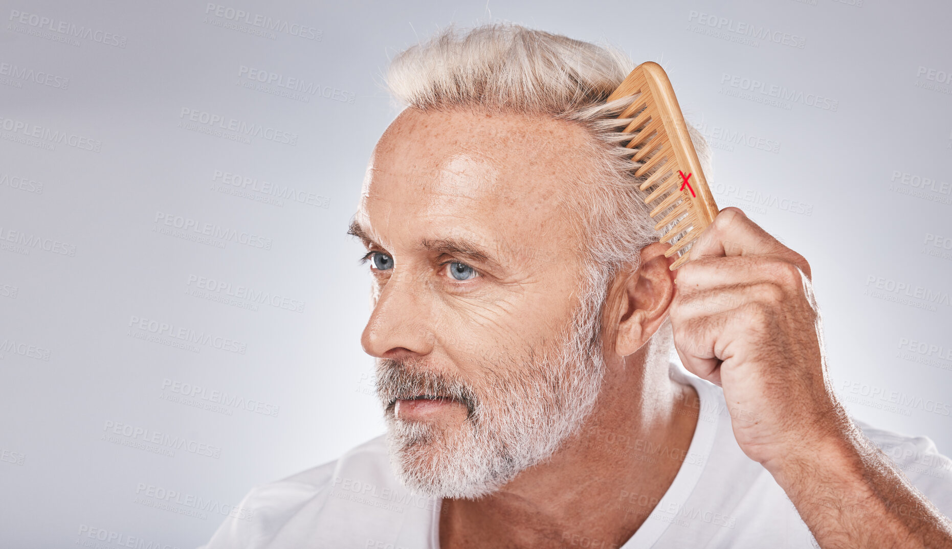 Buy stock photo Cosmetics, senior man and brush hair for grooming, treatment and on grey studio background. Mature male, elderly guy and comb for hair styling, luxury and beauty for wellness, retirement and fresh 